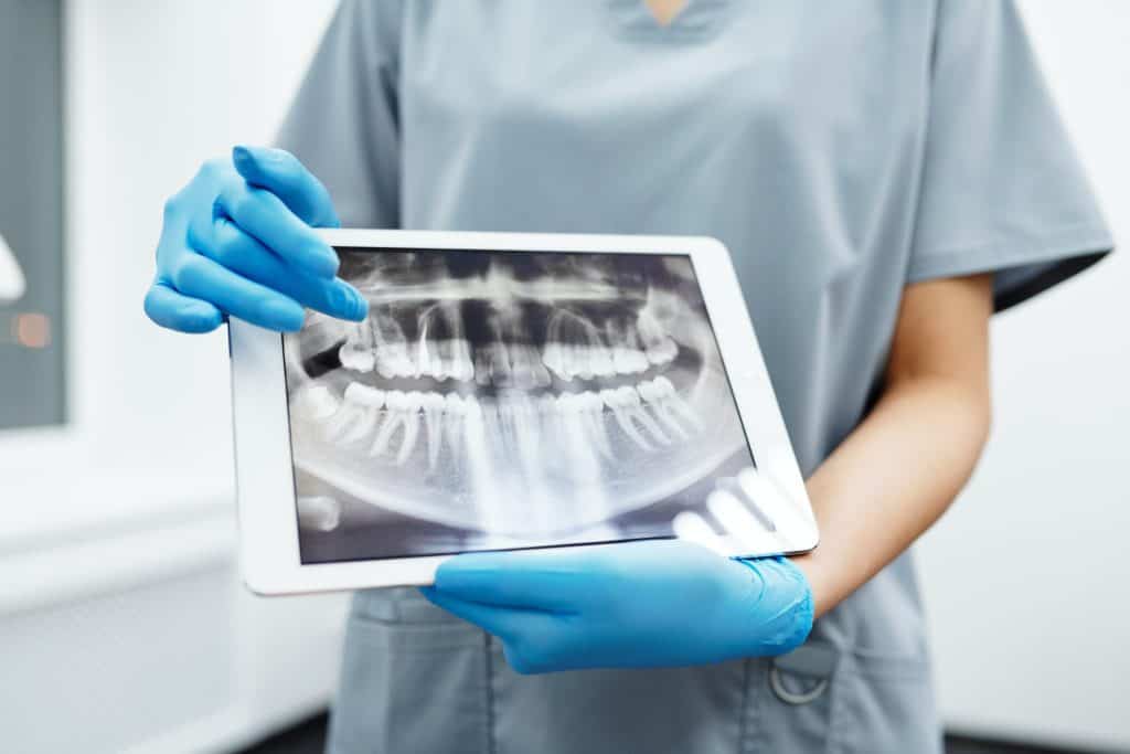 Dentist with dental x-rays