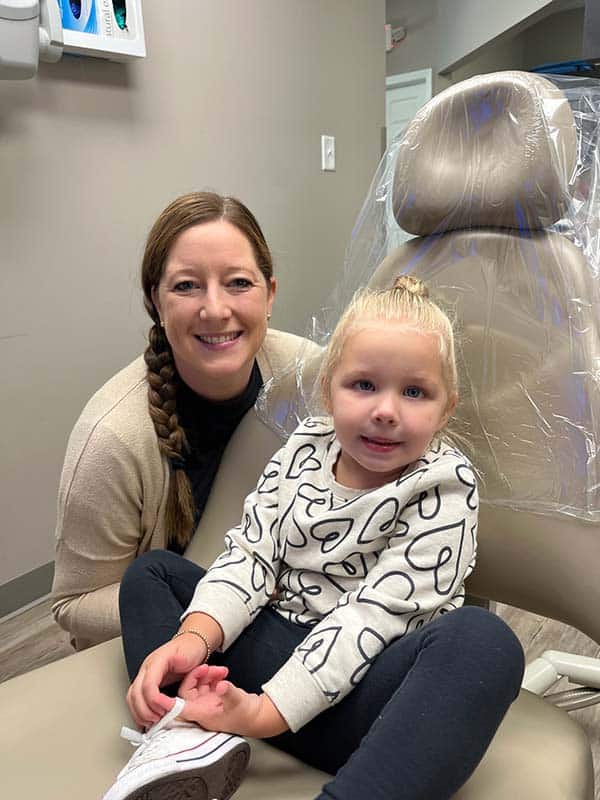 mom and daughter at the dentist