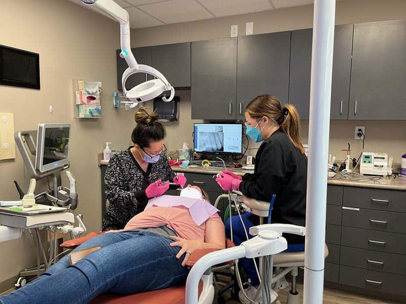 young woman getting a dental cleaning