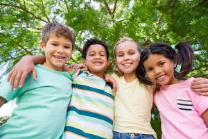 Portrait of smiling kids having fun in park