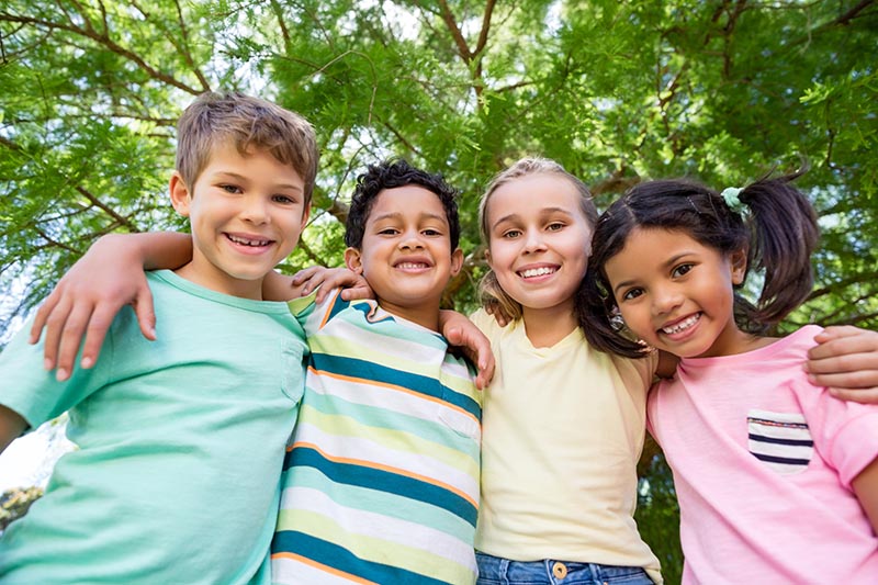 Portrait of smiling kids having fun in park